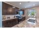 Bright kitchen features granite countertops, stainless steel appliances, and stylish cabinetry at 29405 N 123Rd Gln, Peoria, AZ 85383