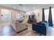 Spacious living room with hardwood floors and comfy seating at 29405 N 123Rd Gln, Peoria, AZ 85383