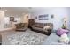 Bright living room with ample seating and decorative accents at 29405 N 123Rd Gln, Peoria, AZ 85383