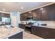 Modern kitchen with granite countertops, stainless steel appliances, and ample cabinetry at 29405 N 123Rd Gln, Peoria, AZ 85383