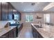Modern kitchen with granite countertops, stainless steel appliances, and an abundance of cabinetry at 29405 N 123Rd Gln, Peoria, AZ 85383