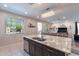 Kitchen island with granite countertop, double sink, and stainless steel dishwasher at 29405 N 123Rd Gln, Peoria, AZ 85383
