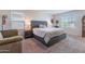 Comfortable main bedroom with large bed and neutral decor at 29405 N 123Rd Gln, Peoria, AZ 85383