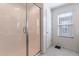 Clean bathroom with a large shower and neutral tile at 29405 N 123Rd Gln, Peoria, AZ 85383