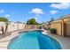Inviting kidney-shaped pool with ample space for lounging at 8894 E Sheena Dr, Scottsdale, AZ 85260