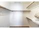 Large walk-in closet with ample shelving and hanging space at 8894 E Sheena Dr, Scottsdale, AZ 85260