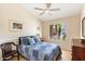 Guest bedroom with a queen bed and access to backyard at 8894 E Sheena Dr, Scottsdale, AZ 85260