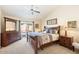 Spacious main bedroom with wood furniture and backyard access at 8894 E Sheena Dr, Scottsdale, AZ 85260