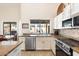 Updated kitchen with granite countertops and stainless steel appliances at 8894 E Sheena Dr, Scottsdale, AZ 85260