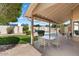 Relaxing patio area with seating and view of the pool and backyard at 8894 E Sheena Dr, Scottsdale, AZ 85260