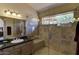 Bathroom with walk-in shower and granite countertop at 8894 E Sheena Dr, Scottsdale, AZ 85260