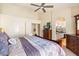 Main bedroom with ensuite bathroom access and large bed at 8894 E Sheena Dr, Scottsdale, AZ 85260
