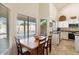 Bright kitchen with a breakfast nook overlooking the pool at 8894 E Sheena Dr, Scottsdale, AZ 85260