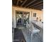 Back patio with bar and seating, adjacent to interior access at 26415 S Recker Rd, Queen Creek, AZ 85142