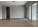 Living room with sliding glass doors and wood-look floors at 15935 W Montana De Oro Dr, Surprise, AZ 85387