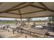 Covered picnic area with multiple tables and benches at 15935 W Montana De Oro Dr, Surprise, AZ 85387