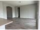 Spacious living room with wood-look floors and high ceilings at 15935 W Montana De Oro Dr, Surprise, AZ 85387