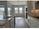 Open concept kitchen with white cabinets and an island at 15935 W Montana De Oro Dr, Surprise, AZ 85387