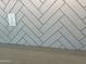 Modern kitchen backsplash with white herringbone tile at 15935 W Montana De Oro Dr, Surprise, AZ 85387