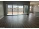Bright living room with sliding glass doors leading to backyard at 15935 W Montana De Oro Dr, Surprise, AZ 85387