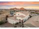 Aerial view of a two-story house with a tan facade and mountain backdrop at 12641 N 18Th Pl, Phoenix, AZ 85022