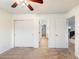 Bedroom with double doors to a closet, and access to the bathroom and upstairs hallway at 12641 N 18Th Pl, Phoenix, AZ 85022