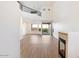 Spacious living room with high ceilings, hardwood floors, and a fireplace at 12641 N 18Th Pl, Phoenix, AZ 85022