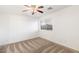 Spacious bedroom with carpeted floors, ceiling fan, and window with blinds at 12641 N 18Th Pl, Phoenix, AZ 85022