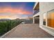 Brick patio with fire pit, mountain views, and a sunset at 12641 N 18Th Pl, Phoenix, AZ 85022