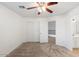 Bright bedroom with carpeted floors, double doors to a large closet, and access to bathroom at 12641 N 18Th Pl, Phoenix, AZ 85022