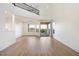Spacious living room with high ceilings, hardwood floors, and a fireplace at 12641 N 18Th Pl, Phoenix, AZ 85022