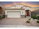 Two-story home with a large garage and well-manicured landscaping at 12641 N 18Th Pl, Phoenix, AZ 85022