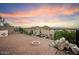 Brick paver patio with fire pit, mountain views, and a security fence at 12641 N 18Th Pl, Phoenix, AZ 85022