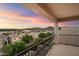 Private balcony boasting scenic mountain and city views at sunset at 12641 N 18Th Pl, Phoenix, AZ 85022