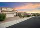 Two-story house with a white garage door and brick driveway at 12641 N 18Th Pl, Phoenix, AZ 85022