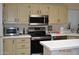 Kitchen with stainless steel appliances, light cabinets and an island at 8500 E Southern Ave # 586, Mesa, AZ 85209