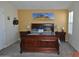 Bedroom with wooden sleigh bed and artwork at 8500 E Southern Ave # 586, Mesa, AZ 85209