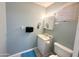 Clean bathroom with a toilet, sink, and medicine cabinet at 905 S Mineshaft Dr, Apache Junction, AZ 85119