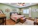 Main bedroom with hardwood floors and ceiling fan at 16449 W Shangri La Rd, Surprise, AZ 85388