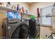 Laundry room with LG washer and dryer, and shelving at 16449 W Shangri La Rd, Surprise, AZ 85388