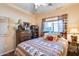 Bedroom with wooden bed, southwestern style bedding at 16449 W Shangri La Rd, Surprise, AZ 85388