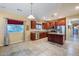 Kitchen with island, stainless steel appliances, and granite countertops at 16449 W Shangri La Rd, Surprise, AZ 85388