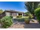 View of home's backyard showcasing green lawn, gravel, and desert landscaping at 16449 W Shangri La Rd, Surprise, AZ 85388