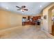 Open living room and kitchen area with tile flooring at 16449 W Shangri La Rd, Surprise, AZ 85388