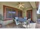 Covered patio with seating area and ceiling fan at 16449 W Shangri La Rd, Surprise, AZ 85388
