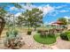 Landscaped backyard with seating area and golf course view at 6202 E Mckellips Rd # 65, Mesa, AZ 85215