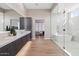 Elegant bathroom featuring double vanity and walk-in shower at 23625 N 63Rd Dr, Glendale, AZ 85310