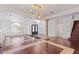 High-ceiling living room with hardwood floors and a staircase at 580 N Benson Ln, Chandler, AZ 85224