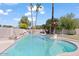 Relaxing kidney-shaped pool with surrounding landscaping at 580 N Benson Ln, Chandler, AZ 85224