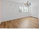 Bedroom with wood floors and colorful chandelier at 580 N Benson Ln, Chandler, AZ 85224